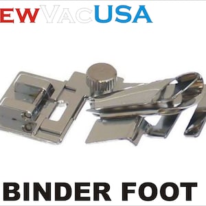 May include: A silver sewing machine binder foot with a small knob on the side. The foot is designed to help create clean, even edges when binding fabric.