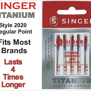 May include: A pack of five Singer Titanium Universal 2020 sewing machine needles with a regular point. The needles are gold with red and blue accents. The packaging is red and white and says "Singer Titanium" and "Lasts 4x Longer".
