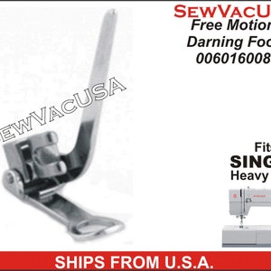 May include: A silver free motion darning foot for Singer heavy duty sewing machines. The foot has a long, curved arm and a spring-loaded mechanism. The foot is labeled "SEWVACUSA Free Motion Darning Foot 006016008".