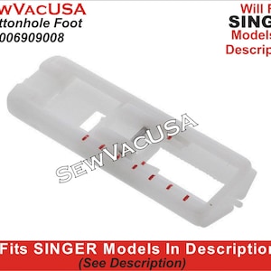 May include: White plastic buttonhole foot for sewing machines. The foot has a small opening in the center and red markings on the side. The foot is labeled "SEWVACUSA Buttonhole Foot 006909008" and "Will Fit SINGER Models In Description".