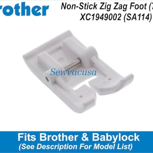May include: White plastic non-stick zig zag sewing machine foot for Brother and Babylock sewing machines. The foot is 7mm wide and has a metal pin. The part number is XC1949002 (SA114).