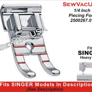 May include: A silver 1/4 inch piecing foot for Singer heavy duty sewing machines. The foot has red markings and is designed for precise quilting and piecing.