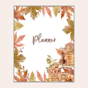 Puede incluir: Una ilustración de acuarela de hojas de otoño, una cesta de flores y un jarrón con la palabra "Planner" en texto marrón.