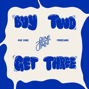 May include: A graphic advertisement with a cream-colored center and blue border. The text reads BUY TWO GET THREE in a bold, rounded blue font. Centered is the text USE CODE FREECARD and a stylized logo with the text DYNE PRINT in blue.