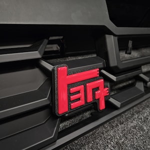 TEQ Grille Badge