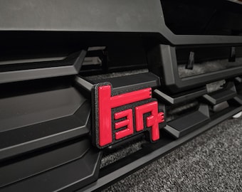 TEQ Grille Badge
