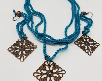 Blue Crochet necklace and dangling earring set with bronze coloured diamond shaped filigree pendant