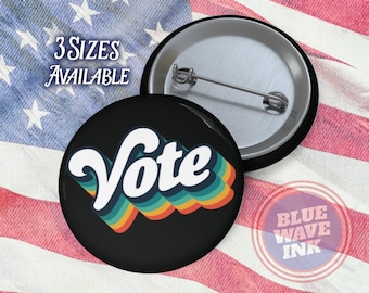 May include: A black button with a rainbow-colored "Vote" graphic. The button is on a red, white, and blue American flag background. The text "3 Sizes Available" is in the upper left corner of the image.