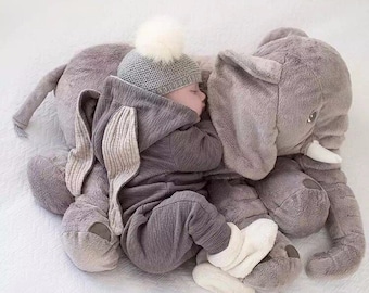 baby with elephant pillow