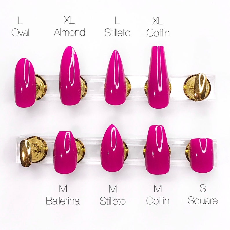 May include: A set of ten pink press-on nails in various shapes and sizes, including oval, almond, stiletto, coffin, ballerina, and square. The nails are arranged in two rows on a white background.