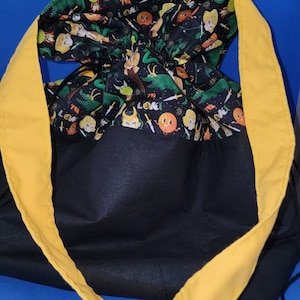Trickster god drawstring tote bag
