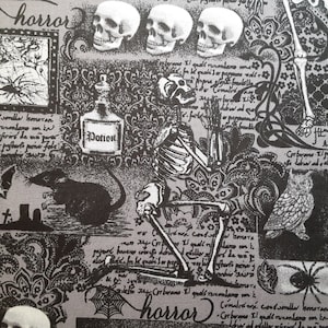 May include: A black and white fabric with a spooky Halloween theme. The fabric features skulls, a skeleton, a rat, an owl, spiders, and the word "horror" repeated. The fabric is printed with a vintage, gothic style.