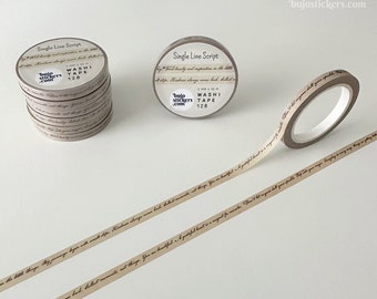 May include: A roll of beige washi tape with brown script text that reads "My journey begins with small steps. Kindness always comes back full circle. You are beautiful. A grateful heart is a magnet for miracles. The little things. My journey begins with small steps. Kindness always comes back full circle. You are beautiful. A grateful heart is a magnet for miracles. The little things." The tape is labeled "Single Line Script" and "bujo stickers.com".
