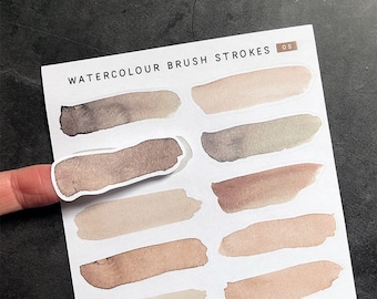 May include: A sheet of watercolour brush stroke stickers. The stickers are in various shades of brown and beige. The sheet is labelled "Watercolour Brush Strokes 05".