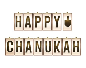 Könnte beinhalten: Ein festliches Schild mit den Worten "HAPPY CHANUKAH" in goldenen Buchstaben. Die Buchstaben befinden sich in einzelnen rechteckigen Rahmen mit einem warmen, leuchtenden Licht. Ein Dreidel-Symbol ersetzt den Buchstaben "Y".