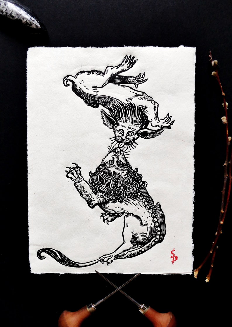 May include: Black and white woodcut print of a lion and a mythical creature with a long tail and a mane. The lion is on the bottom and the mythical creature is on top of the lion. The mythical creature is biting the lion's neck.