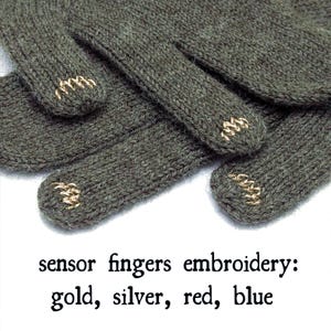 May include: Close-up of olive green knit gloves with gold embroidery on the fingertips. The text in the image reads "sensor fingers embroidery: gold, silver, red, blue."