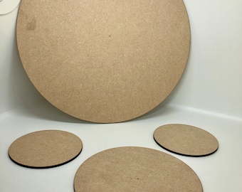 May include: Four round wooden craft blanks in various sizes. The largest blank is approximately 12 inches in diameter. The three smaller blanks are approximately 4 inches in diameter.