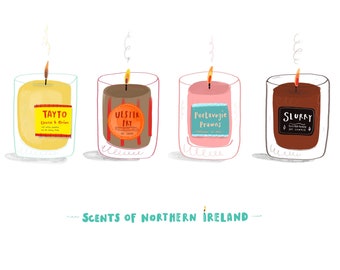 May include: Four scented candles with labels referencing Northern Irish food and drink. The candles are yellow, brown, pink, and brown and are arranged in a row. The labels read "Tayto Cheese & Onion", "Ulster Fry", "Portavogie Prawns", and "Slurry". The text "Scents of Northern Ireland" appears below the candles.