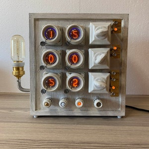 Nixie clock made from old ceramic electrical panel