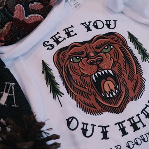 See you out there - bear white crewneck