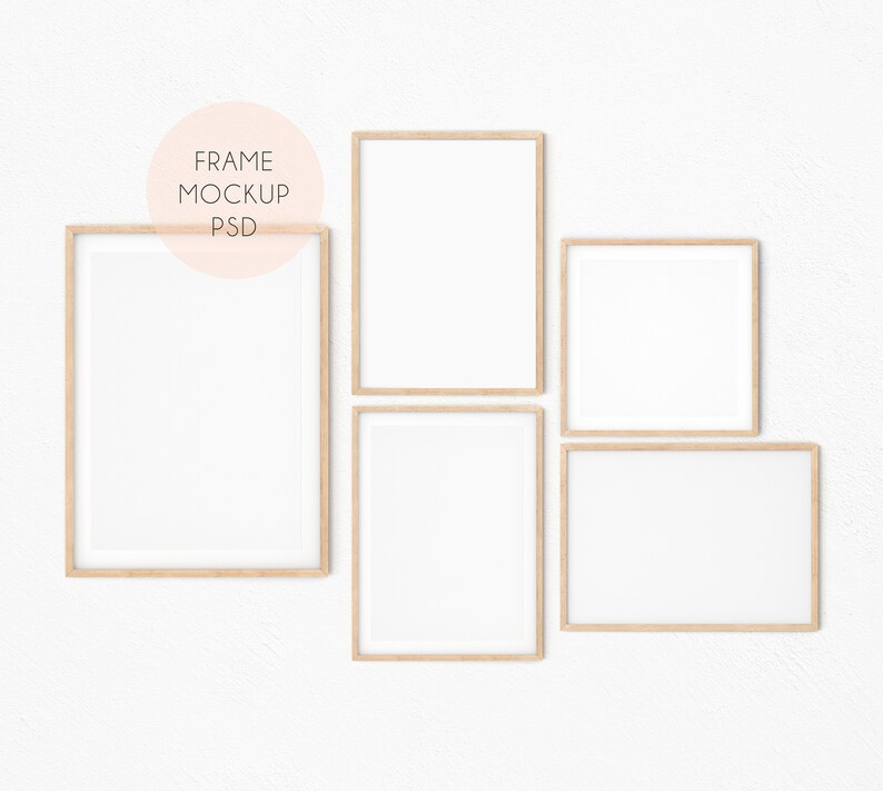 May include: Four wooden picture frames with white mats on a white wall. The frames are arranged in a staggered pattern. The frames are all the same size and shape.