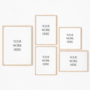 May include: Five wooden picture frames with white mats and a white background. The frames are arranged in a grid pattern. The text "YOUR WORK HERE" is printed in black inside each frame.