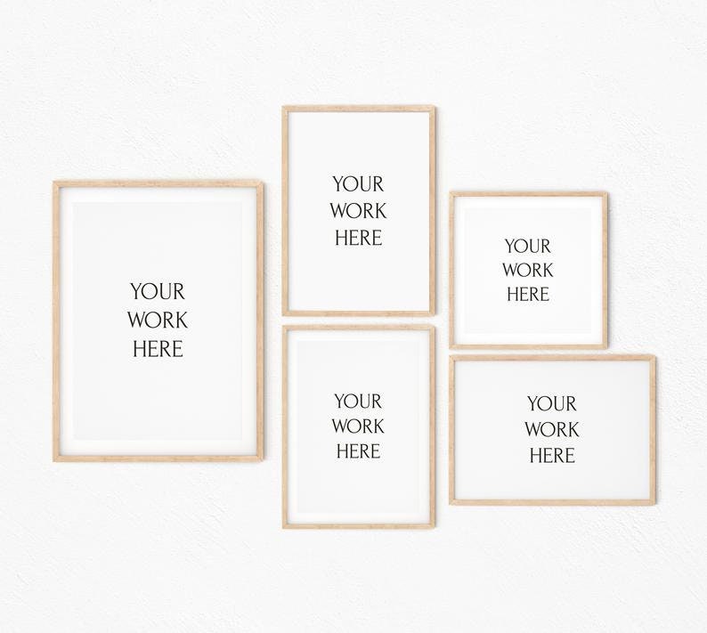 May include: Five wooden picture frames with white mats and a white background. The frames are arranged in a grid pattern. The text "YOUR WORK HERE" is printed in black inside each frame.