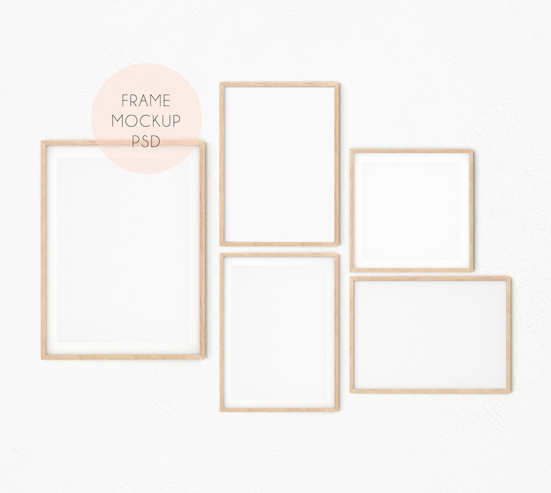May include: Four wooden picture frames with white mats on a white wall. The frames are arranged in a staggered pattern. The frames are all the same size and shape.