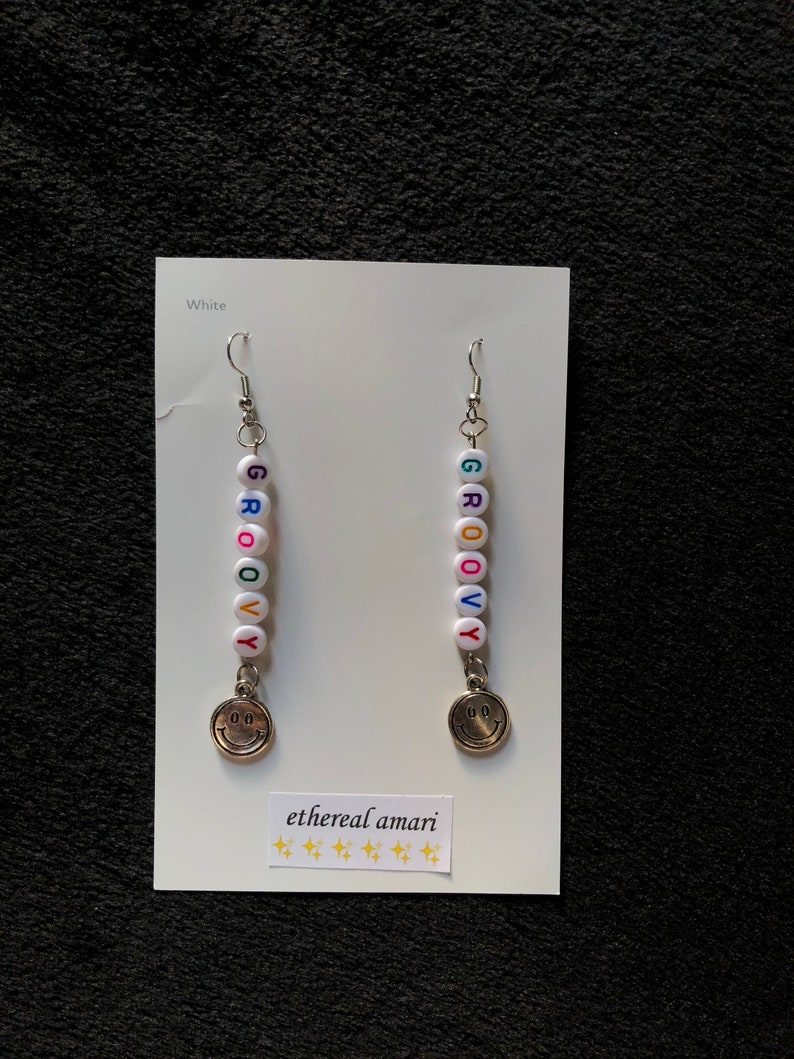 handmade trippy smiley pin earrings!