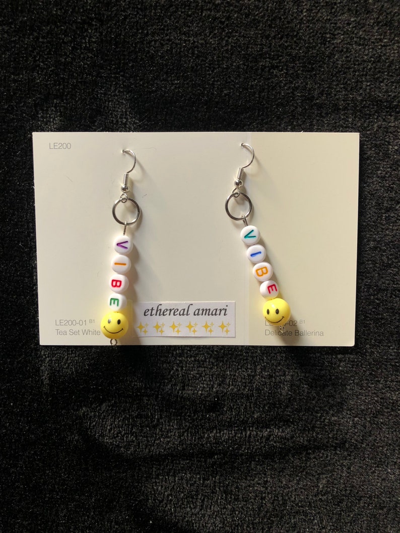 handmade trippy smiley pin earrings!