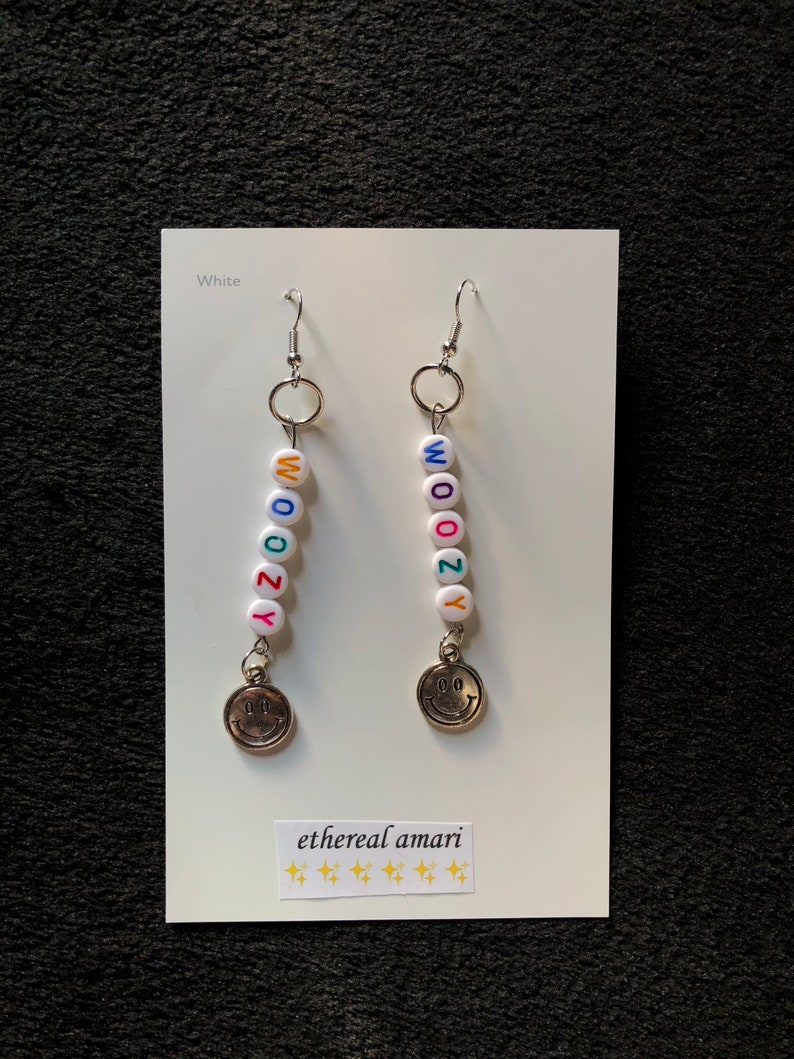 handmade trippy smiley pin earrings!