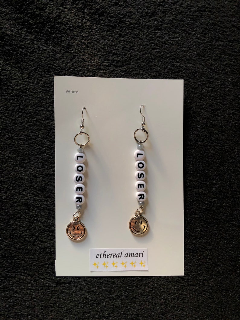 handmade trippy smiley pin earrings!