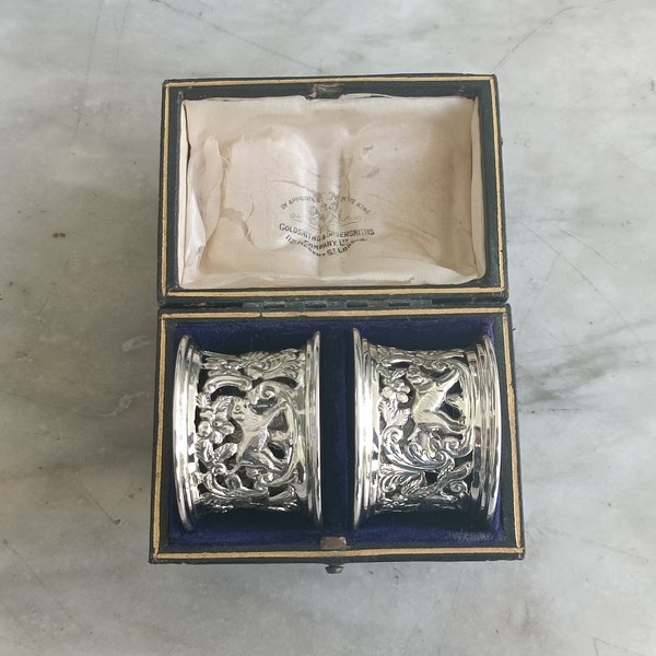 Magnificent pair of English Victorian silver napkin rings