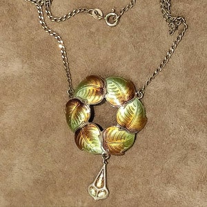 Art Nouveau enamelled silver pendant on chain.
