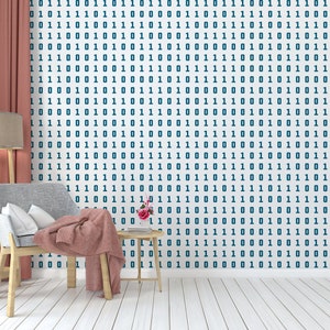May include: A living room interior with a red curtain, a wooden floor, a grey armchair with a pink throw blanket, a wooden side table with a vase of pink flowers, and a floor lamp with a beige lampshade. The wall is covered with a white wallpaper with a repeating pattern of blue 1s and 0s.
