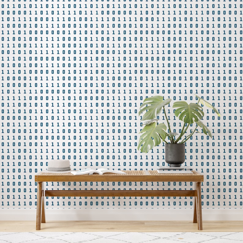 May include: A wooden bench with a book on top sits in front of a white wall with a blue and white binary code pattern. A potted plant with green leaves is on the right side of the bench.