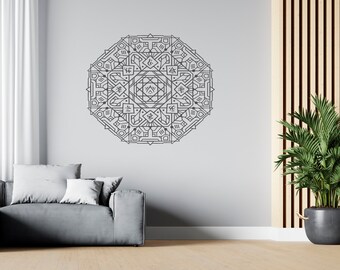May include: A gray geometric mandala wall decal with intricate patterns and designs. The decal is applied to a white wall in a living room setting with a gray couch and a potted plant.