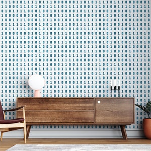 May include: A living room interior featuring a brown leather armchair, a wooden cabinet, a lamp, and a potted plant. The wall is decorated with white wallpaper featuring a repeating pattern of blue 1s and 0s.