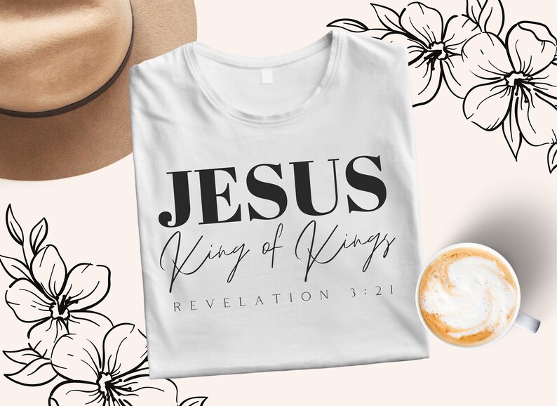 May include: White t-shirt with black text that reads "JESUS King of Kings REVELATION 3:21".