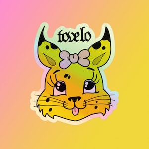May include: A yellow cartoon cat with black spots and a purple bow. The cat has big eyes and a tongue sticking out. The text "toxelo" is written above the cat.