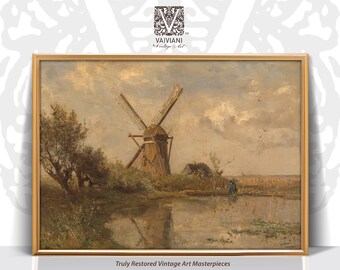 May include: A vintage oil painting depicting a windmill in a rural landscape. The windmill is brown with white blades and is situated near a body of water. The sky is a light blue with white clouds. The painting is framed in a gold frame.