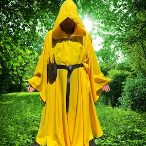 May include: A bright yellow hooded cloak with long, wide sleeves and a full-length drape. A black leather belt is fastened around the waist, featuring a small, matching black leather pouch attached to the side, creating a functional accessory set.