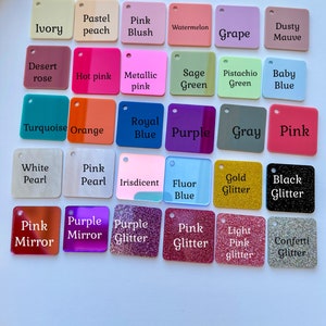May include: A selection of square acrylic colour swatches in various shades, including ivory, pink, blue, green, and purple. Each swatch has a small hole and a printed colour name, such as "Gold Glitter" and "Baby Blue."
