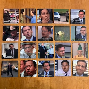 May include: A set of 16 square magnets featuring characters from the TV show "The Office". Each magnet has a different image of a character from the show, with a quote or caption underneath. The magnets are printed on a white background with black text.