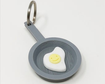 Porte-clés oeuf smiley poêle à frire