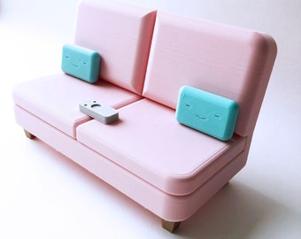 The Pink Colab Couch Phone Holder with Remote and Pillows