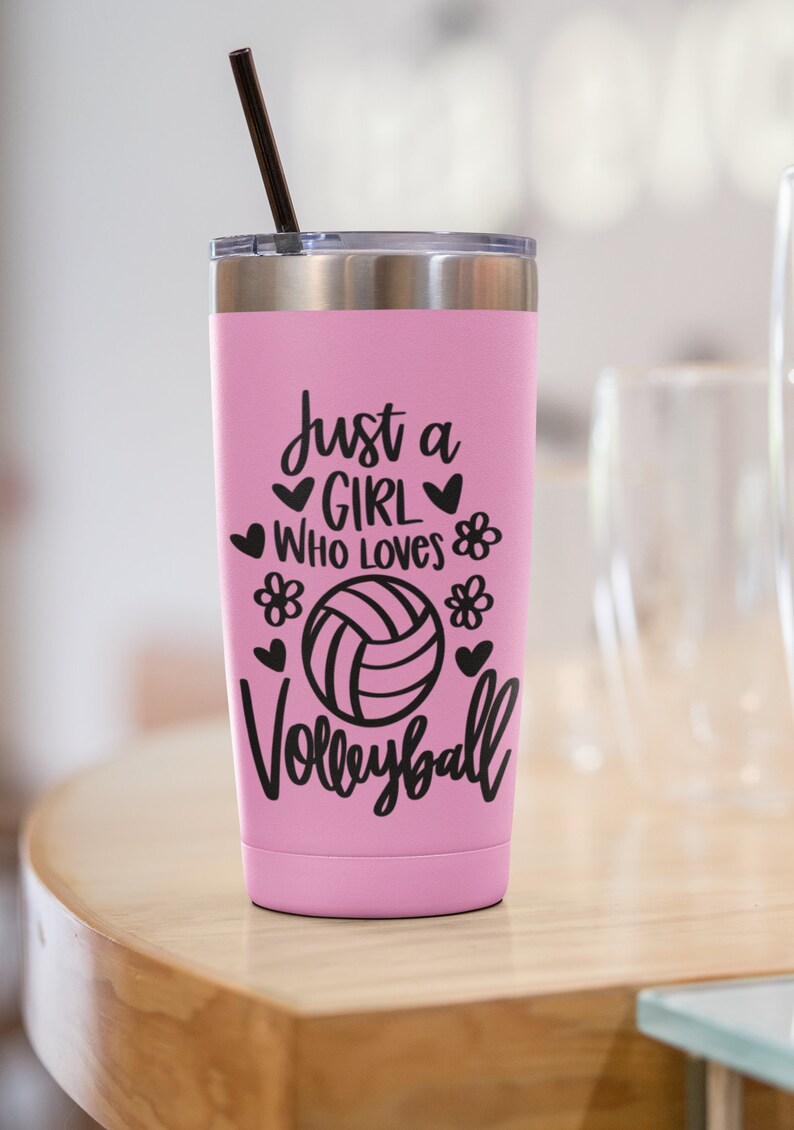 May include: Pink stainless steel tumbler with a black straw and a black vinyl decal that reads "Just a girl who loves volleyball" with a volleyball graphic and hearts and flowers.