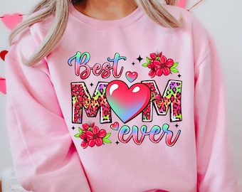 May include: Pink sweatshirt with the text "Best Mom Ever" in rainbow colors with a large heart and leopard print letters.