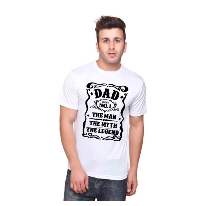 May include: White t-shirt with a black graphic that says "Dad - Best No.1 - The Man - The Myth - The Legend".